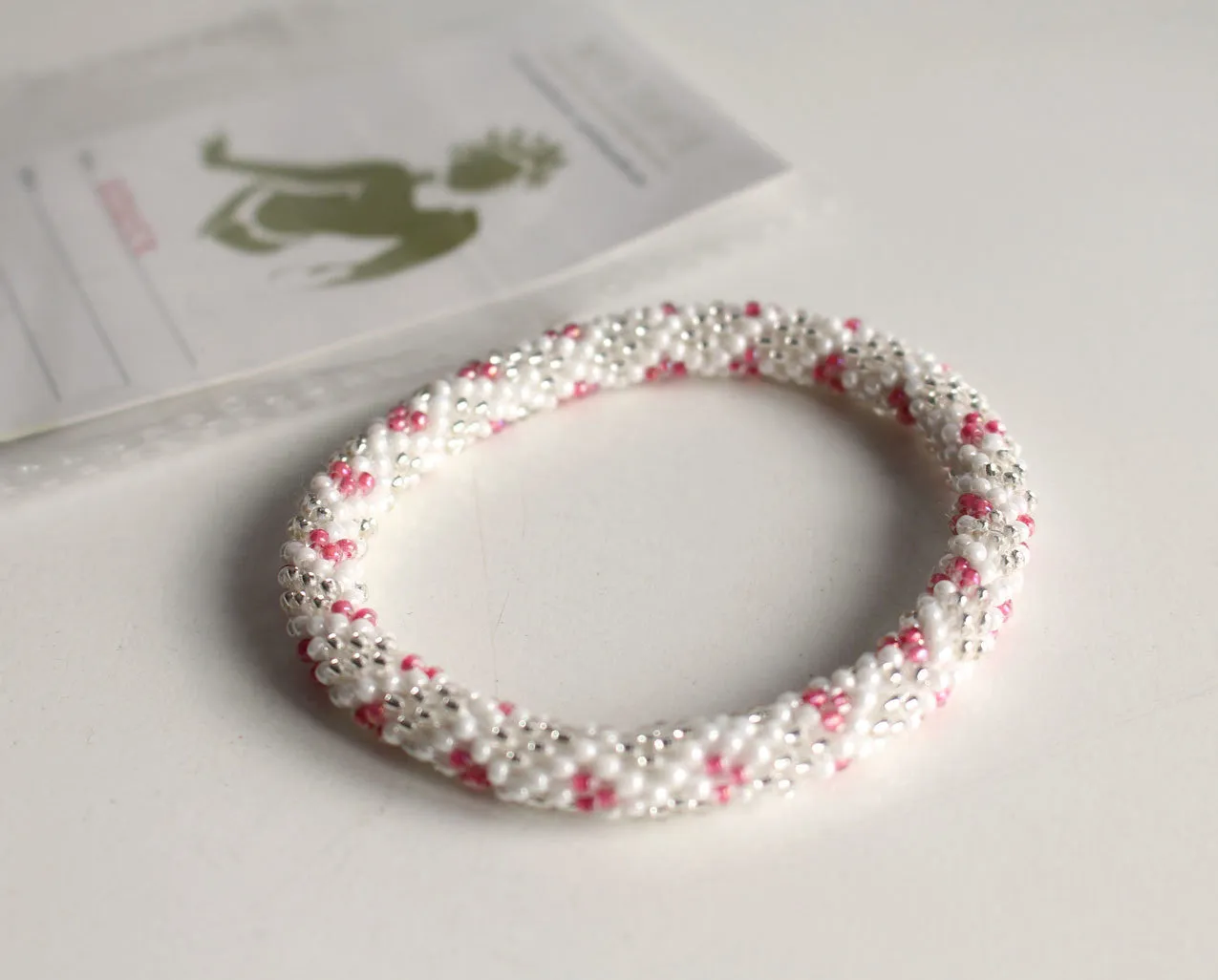 White Silver and Pink Crocheted Beads Roll On Bracelet